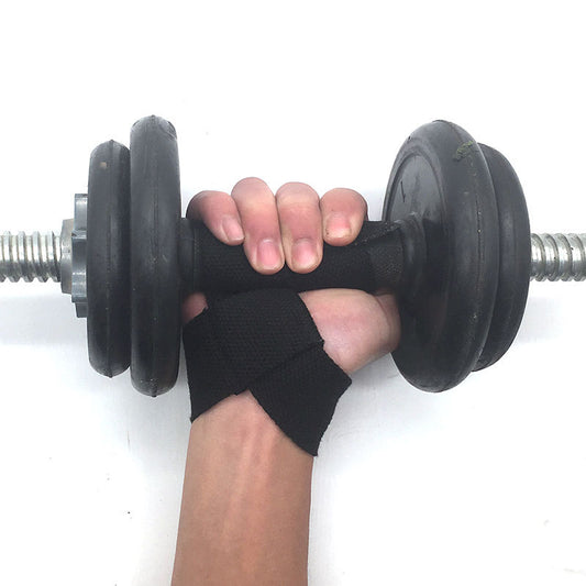 Hand gripping a dumbbell using PhantomGrip Lifting Straps for secure lifting support.